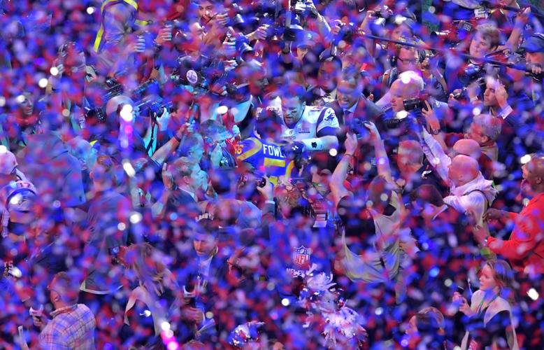 New England Patriots quarterback Tom Brady (12) greets Los Angeles Rams linebacker Dante Fowler (56) after Super Bowl LIII on Sunday, Feb. 3, 2019, at Mercedes-Benz Stadium in Atlanta. The Patriots won, 13-3.