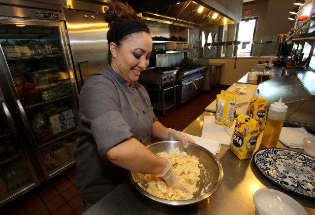 Making arepas, Colombian and Venezuelan bread