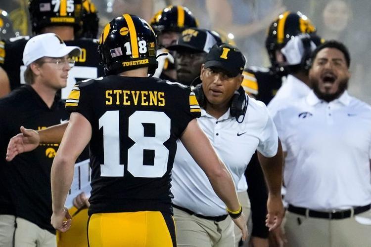 Iowa Hawkeyes special teams coordinator LeVar Woods high-fives place kicker Drew Stevens (18) during a game against the Albany Great Danes Aug. 30, 2025 at Kinnick Stadium in Iowa City, Iowa.
