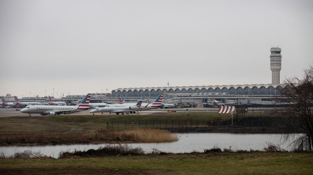 An American Airlines planes are seen at Ronald Regan National Airport in Washington, D.C. on Friday March 13, 2020. President Donald Trump has imposed a travel ban on 26 European countries after the World Health Organization named the coronavirus a global pandemic. The decision has major consequences for the world of travel and travelers.