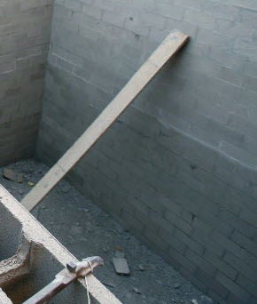 A concrete block wall under construction