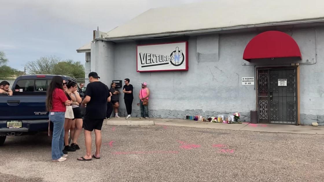 The scene outside the Venture-N bar Monday evening where community members gathered after the shooting for two men