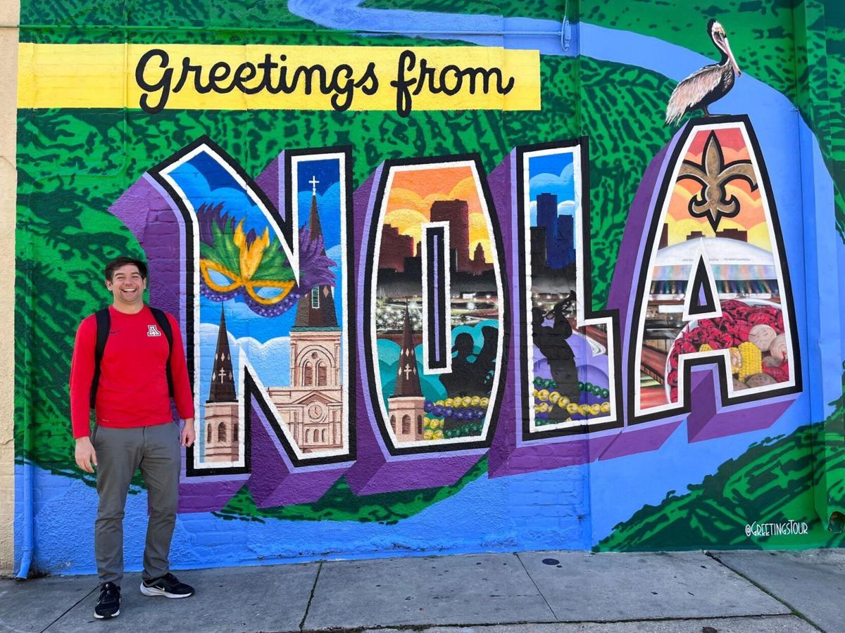 Eddie at NOLA sign on Magazine St.