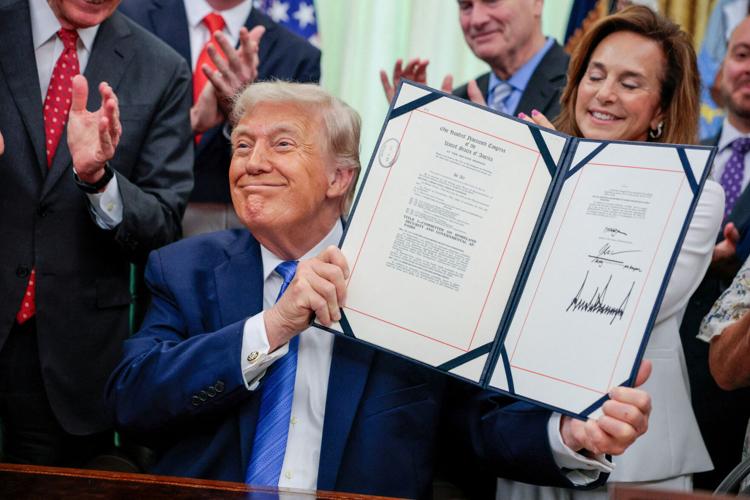 U.S. President Trump signs the Secure America Act in the Oval Office at the White House
