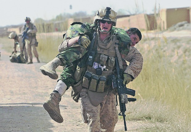 Marines, Afghan troops advance under withering Taliban gunfire   