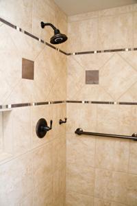 Can I install a grab bar in shower walls covered in cultured marble?