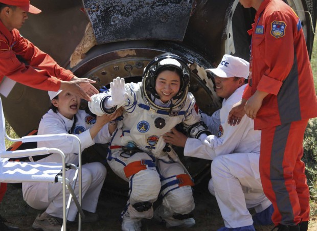 Chinese astronauts back after 13-day trek    