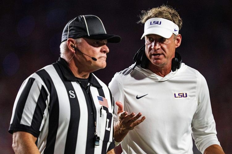 LSU head coach Lane Kiffin talks with an official during a college football game between Ole Miss and LSU at Vaught Hemingway