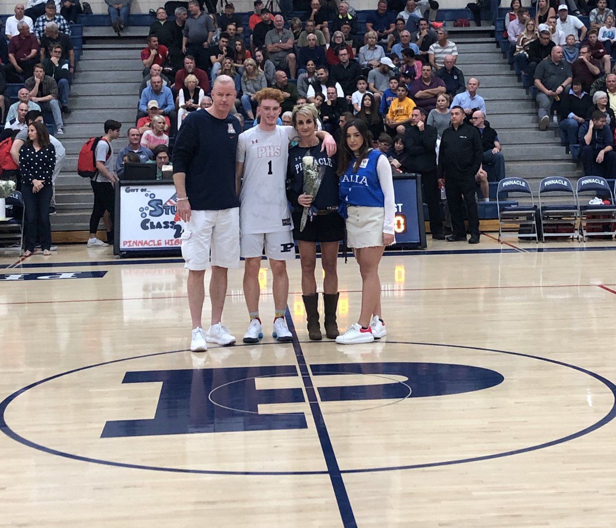 Nico Mannion on senior night