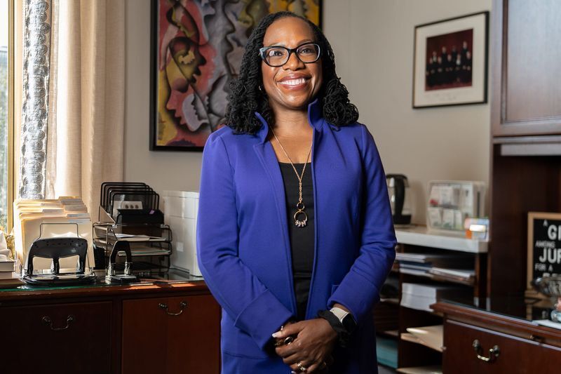 Sep 20, 2024; Washington, D.C., U.S. Supreme Court Justice Ketanji Brown Jackson poses in front of a a portrait by Lonnie Holley titled “From the Fields of America to the Halls of Justice” that he made for her. Mandatory Credit: Megan Smith-USA TODAY