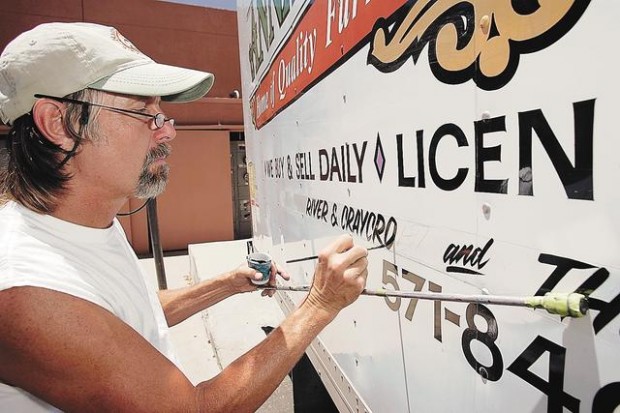 Commercial artist deals in eye-catching signs  