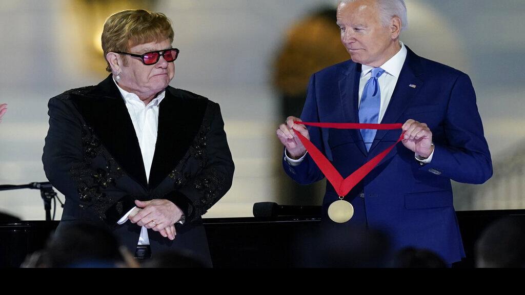 Biden surprises Elton John with National Humanities Medal after White House concert