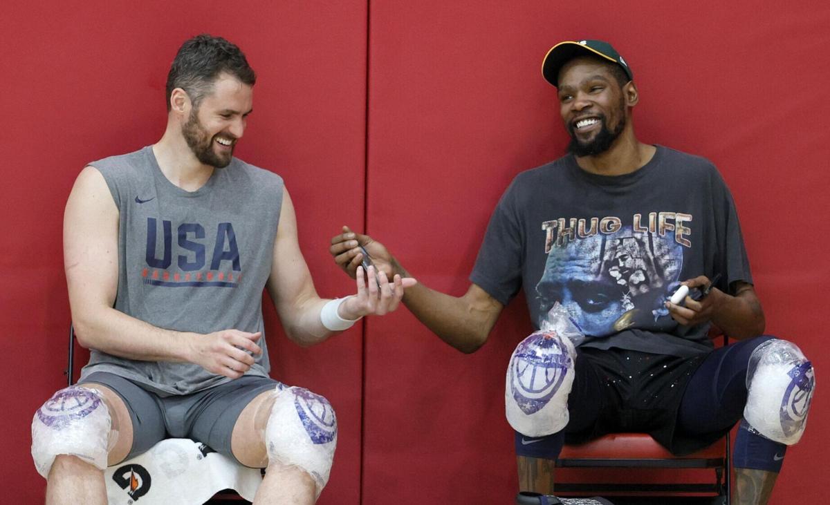 The United States' Kevin Love, left, and Kevin Durant share a laugh after a USA Basketball Men's National Team practice at the Mendenhall Center at UNLV as the team prepares for the Tokyo Olympics, on Wednesday, July 7, 2021 in Las Vegas.