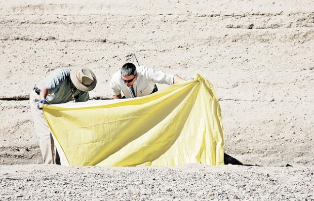 Detectives await tests on body of man, 21, found in riverbed  