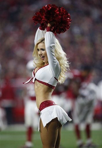 An Arizona Cardinals cheerleader performs at the two minute