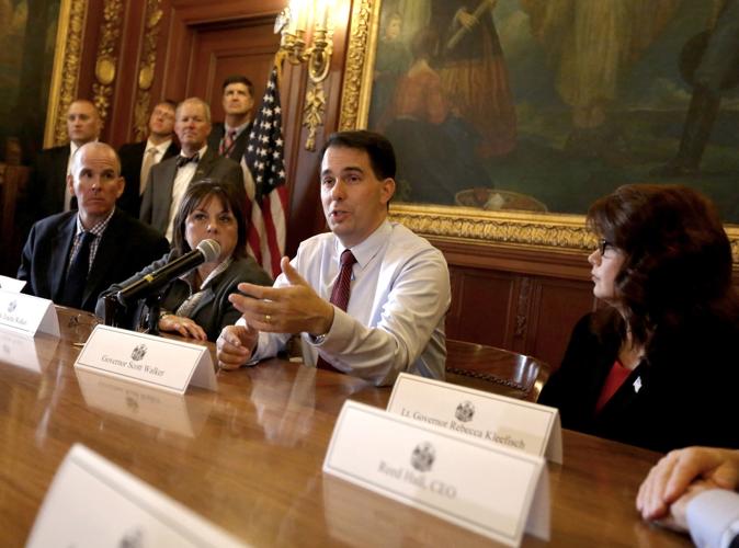 Scott Wallker and cabinet, State Journal photo, with drug testing story (copy)