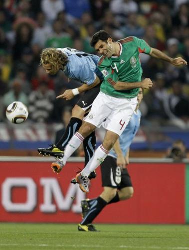 Mexico advances despite loss   