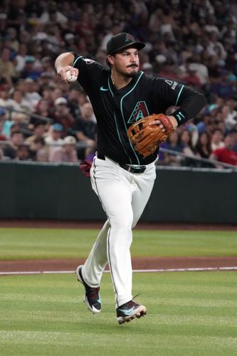 D-backs third baseman Nolan Arenado makes the throw against the Texas Rangers in the fifth inning at Chase Field in Phoenix on Sept. 12, 2026.