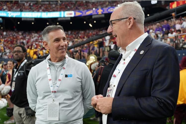 Sep 1, 2024; Paradise, Nevada, USA; Big 10 commissioner Tony Petitti (left) and SEC commissioner Greg Sankey attend the game between the LSU Tigers and the Southern California Trojans at Allegiant Stadium. Mandatory Credit: Kirby Lee-USA TODAY Sports