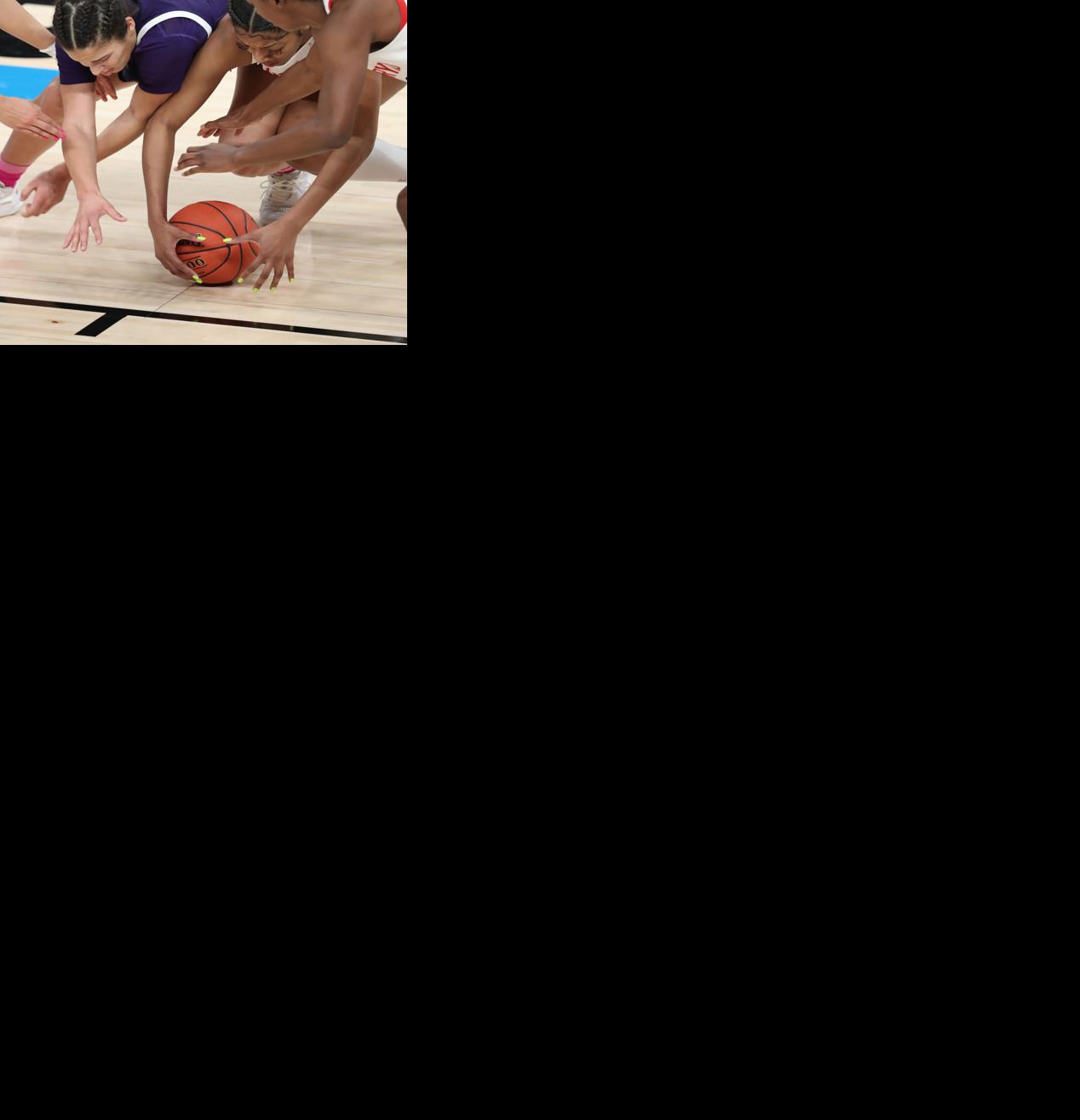 Maryland Terrapins forward Angel Reese, center right, causes a turnover as Northwestern Wildcats guard Veronica Burton loses the ball in the second quarter of a Big Ten women's basketball tournament semifinal game at Bankers Life Fieldhouse Friday, March 12, 2021, in Indianapolis.