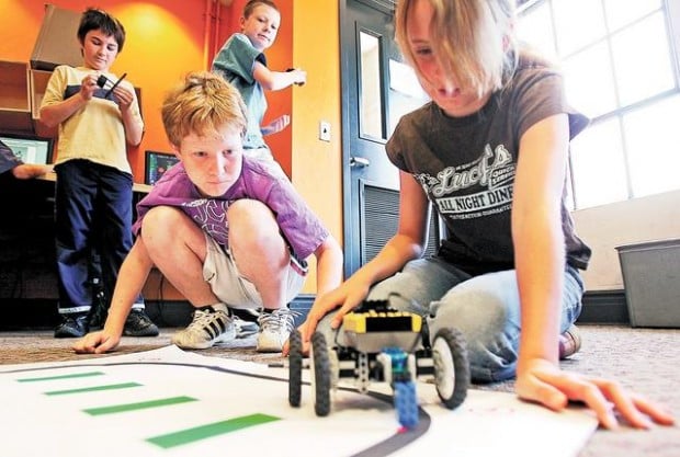 Kids learn science, math with Robots