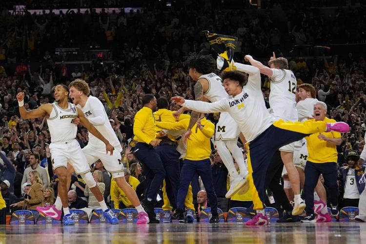 APTOPIX NCAA UConn Michigan Basketball