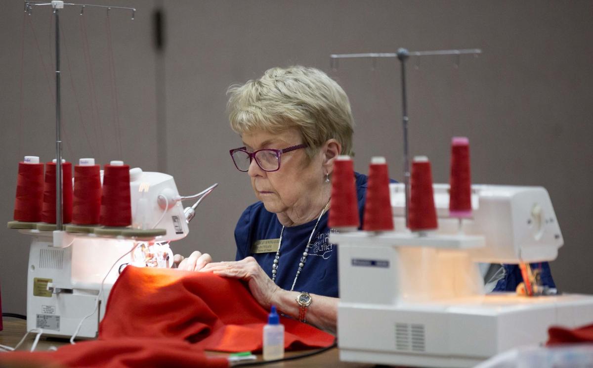 Sewing guild members help Tucson Medical Center dress babies for the