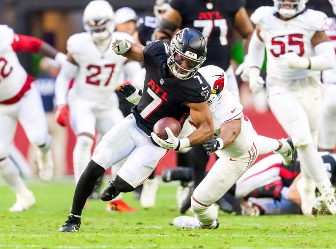 Dec 21, 2025; Glendale, Arizona, USA; Atlanta Falcons running back Bijan Robinson (7) against the Arizona Cardinals at State Farm Stadium. Mandatory Credit: Mark J. Rebilas-Imagn Images