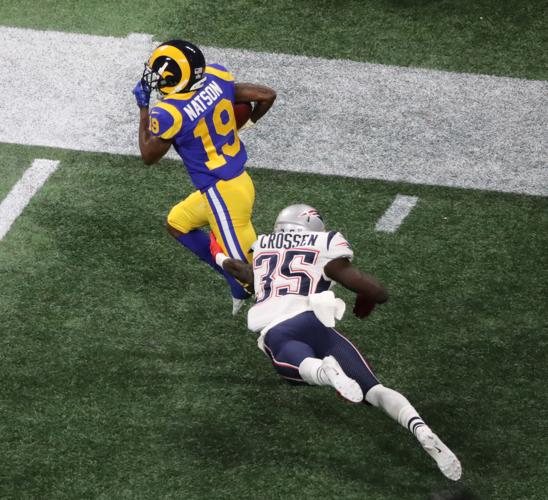 Los Angeles Rams wide receiver JoJo Natson (19) returns a kick in the second quarter, making New England Patriots defensive back Keion Crossen (35) miss a tackle during Super Bowl LIII on Sunday, Feb. 3, 2019, at Mercedes-Benz Stadium in Atlanta. The Patriots won, 13-3.
