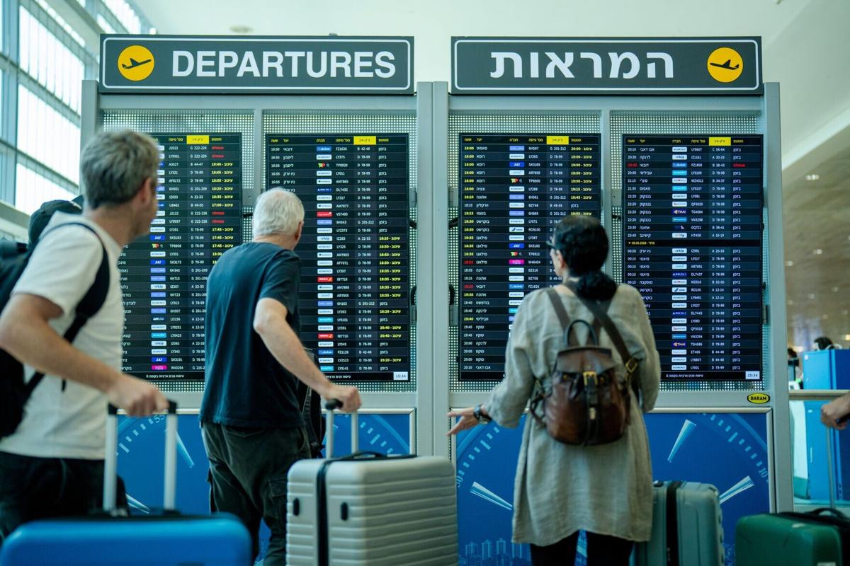 Passengers check the departure board inside the Departure Hall at Ben Gurion International Airport on June 8, 2026, in Tel Aviv, Israel. Aviation officials kept the country's main gateway open following a wave of early morning Iranian missile strikes. Iran and Israel are once again trading attacks after Iran launched a series of missiles at Israel on June 7, for...