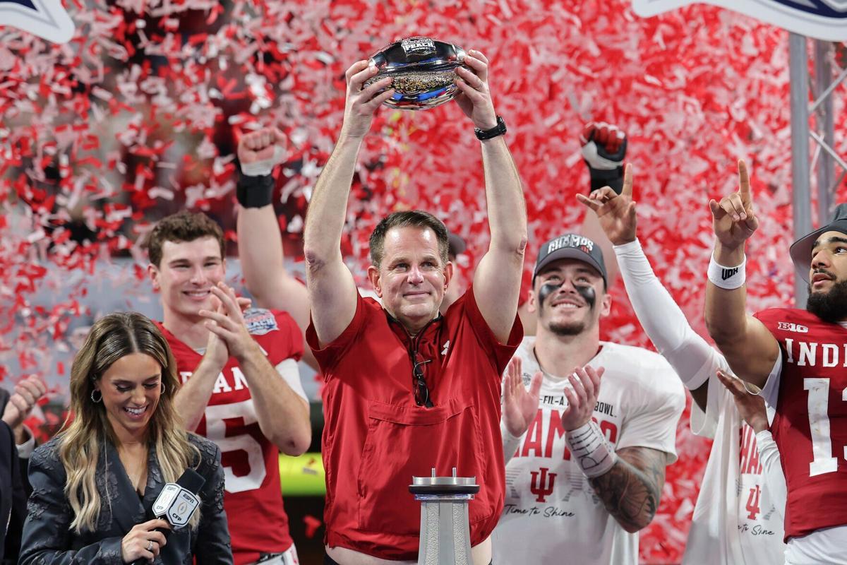 Head coach Curt Cignetti of the Indiana Hoosiers hoists the George P. Crumbley Trophy after defeating the Oregon Ducks in the 2026 College Football Playoff Semifinal at the Chick-fil-A Peach Bowl at Mercedes-Benz Stadium on Jan. 9, 2026, in Atlanta.