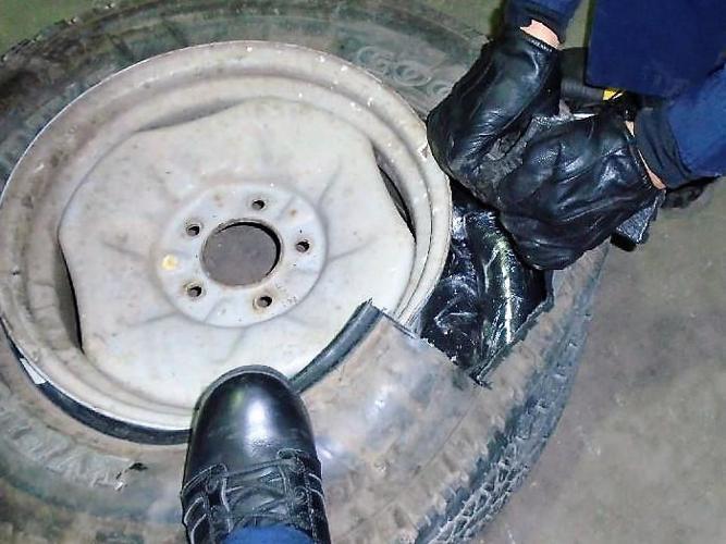 Officers find drugs hidden in a spare tire