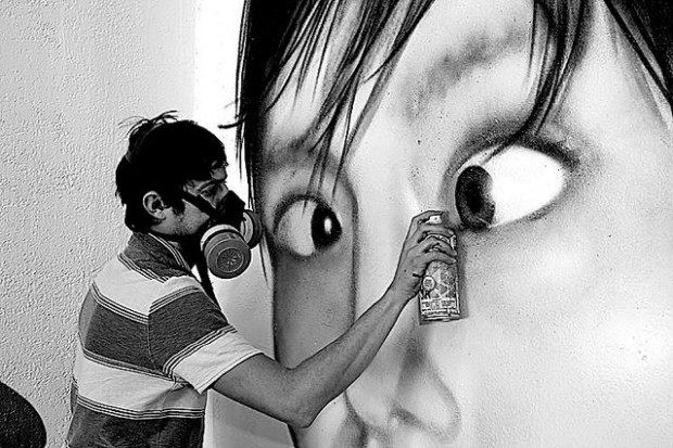 Local graffiti artist Cyfi has turned his hobby into a career  