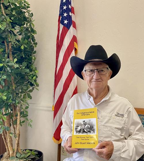 Stuart-Watkins-with-book-and-flag.jpeg