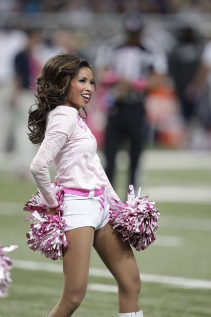 A St. Louis Rams cheerleader entertains the crowds during the