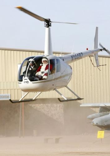 Santa lands at Pima air museum   