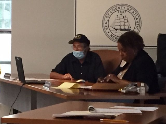 Democratic Commissioners John Mooney and Audrey Miles