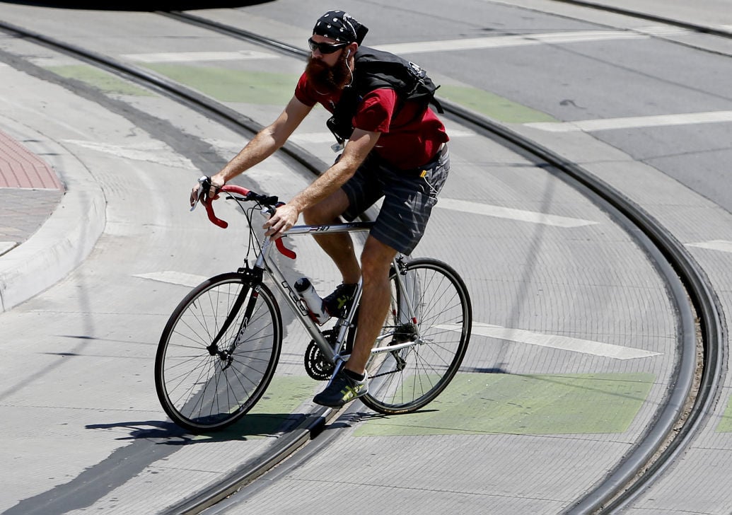 Bicyclists crossing streetcar tracks