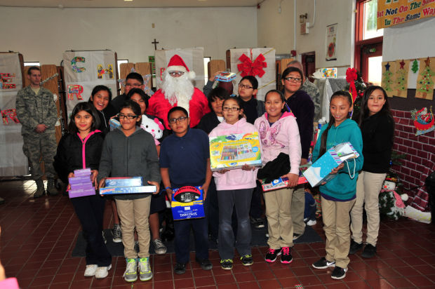 D-M’s Santas-in-blue visit local school