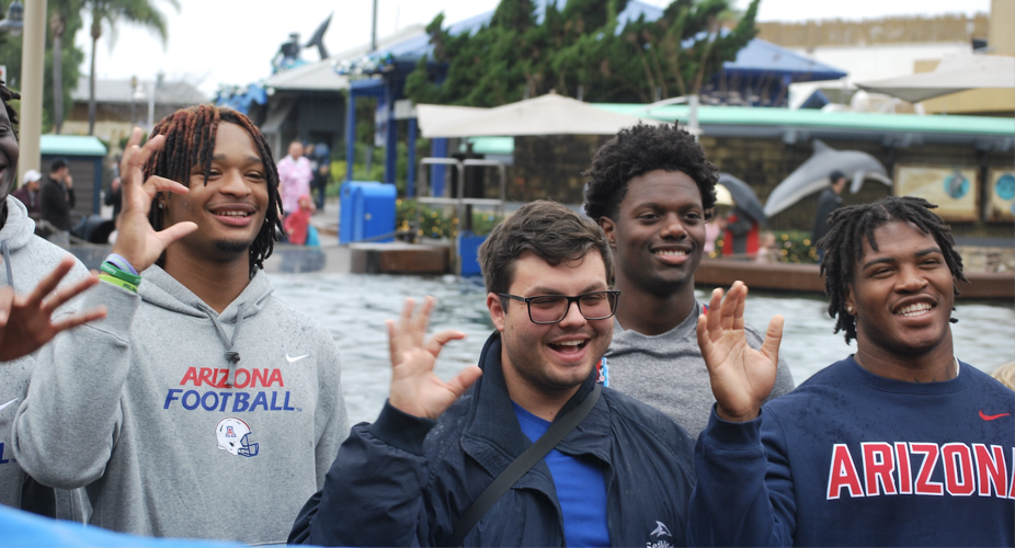 Arizona football dolphin interaction at SeaWorld San Diego