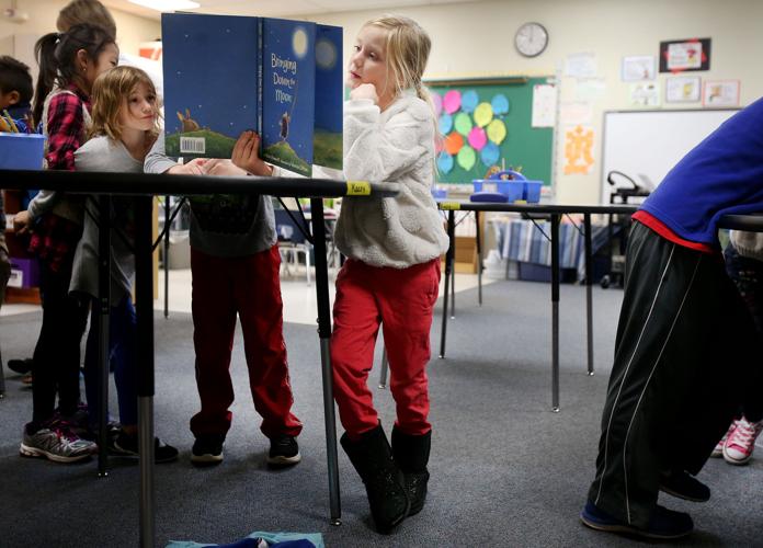 Kids use standing desks