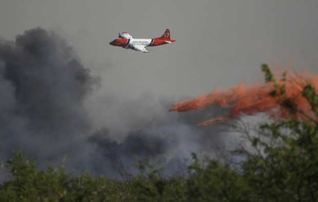 Thousands more flee SV as fire incinerates homes   