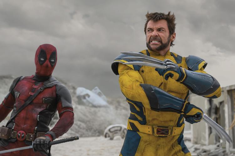 Hugh Jackman (right) is back in the claws and superhero suit as Wolverine alongside Ryan Reynolds as Deadpool in "Deadpool & Wolverine."