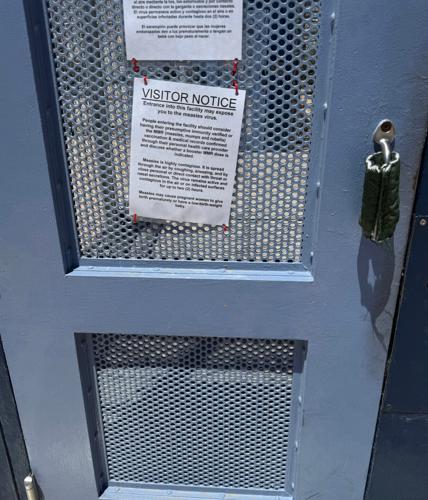 A sign warns people arriving to the Eloy Detention Facility about possible measles exposure.