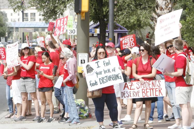 Teacher rally Darth Vader sign