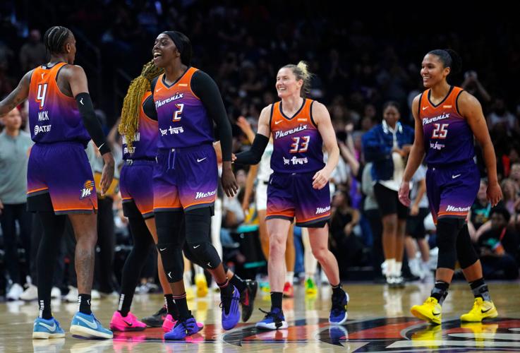 Mercury guard Kahleah Copper (2), Sami Whitcomb (33) and Alyssa Thomas (25) celebrate against the Liberty during a game in Phoenix, at PHX Arena on June 27, 2025.