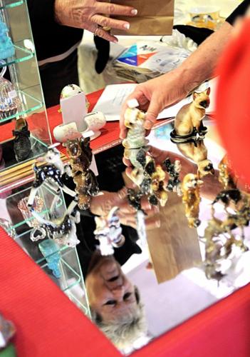 Monthly antique fair chugs on no matter holiday or weather   