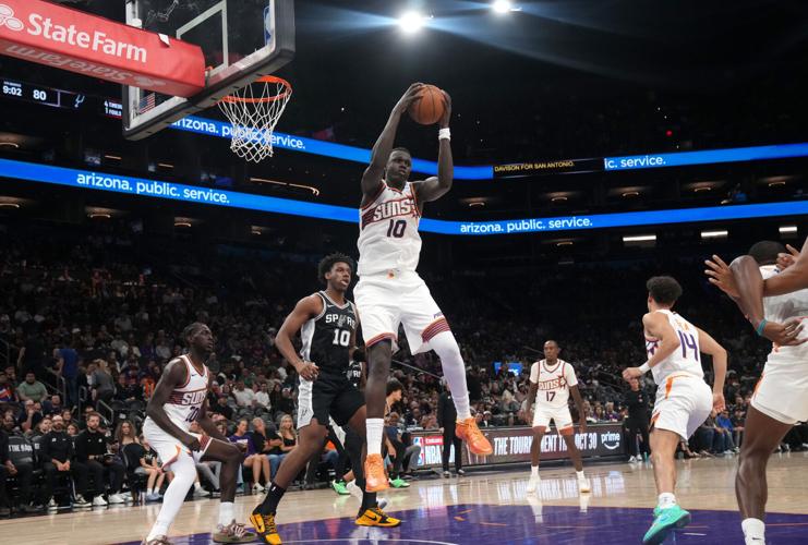 Phoenix Suns center Khaman Maluach (10) grabs a rebound against the San Antonio Spurs at Mortgage Matchup Center in Phoenix on Oct. 10, 2026.