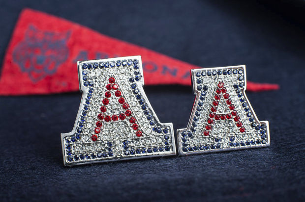 Shirts and caps are fine, but the Big Dance calls for shiny UA bling