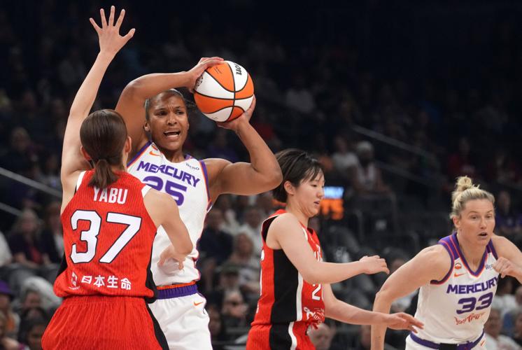 Phoenix Mercury forward Alyssa Thomas (25) looks to pass the ball as Team Japan guard Minami Yabu (23) defends during their preseason game at Mortgage Matchup Center in Phoenix, on April 29, 2026.
